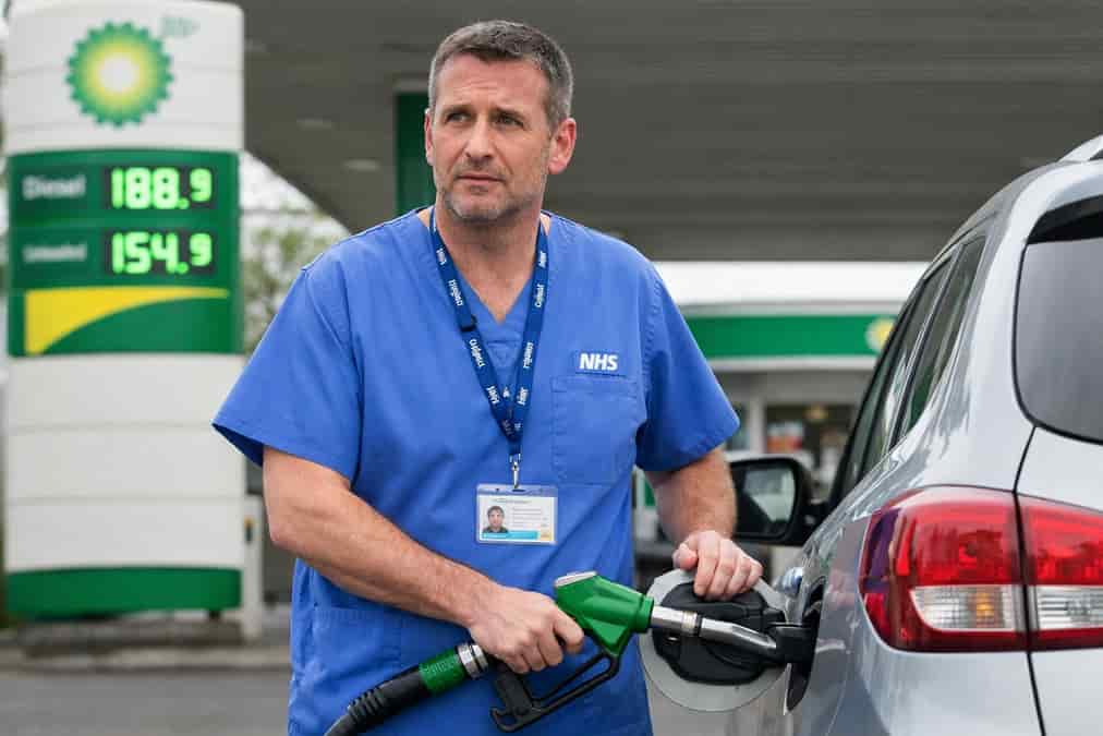 NHS worker refueling at BP station
