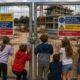 Children at construction site gate